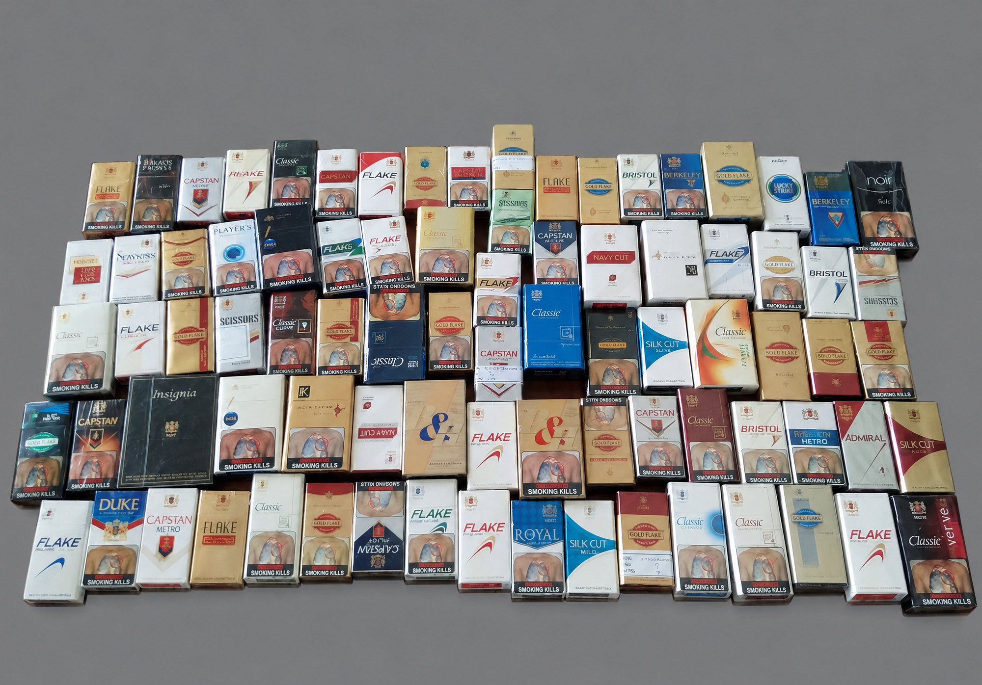 Rows of cigarette packs of many brands and print layouts